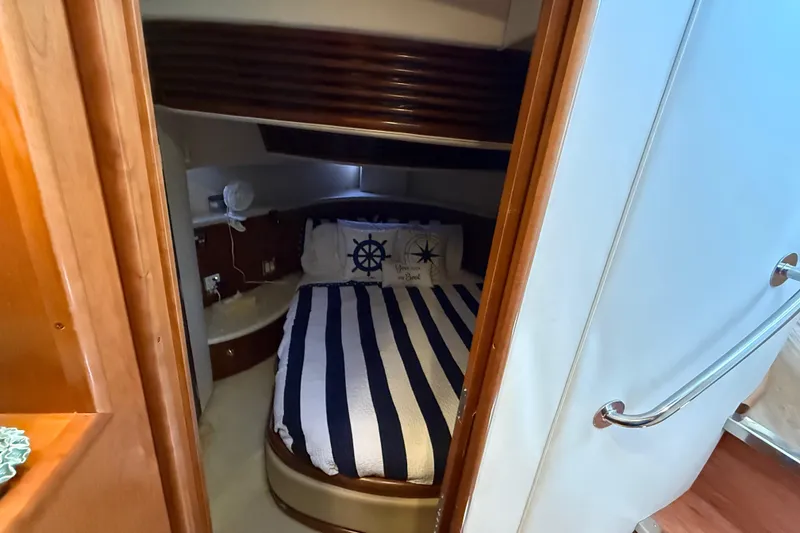 Slide: The Image of Cozy cabin interior of 1999 Carver 450 Voyager Pilothouse with nautical bedding. - 37