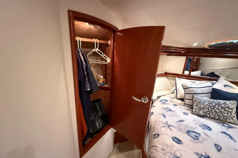 Slide: The Image of Luxurious cabin interior of 1999 Carver 450 Voyager Pilothouse with closet and bed. - 39
