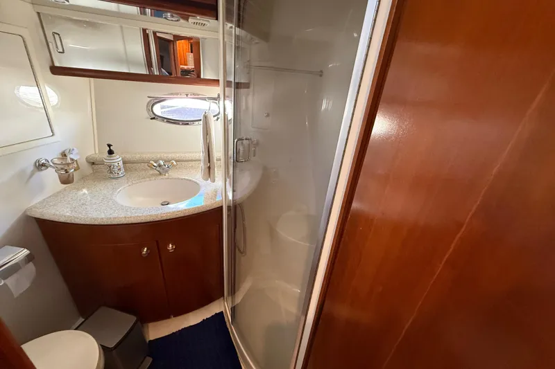 Slide: The Image of Luxurious bathroom in 1999 Carver 450 Voyager Pilothouse yacht with modern amenities. - 40
