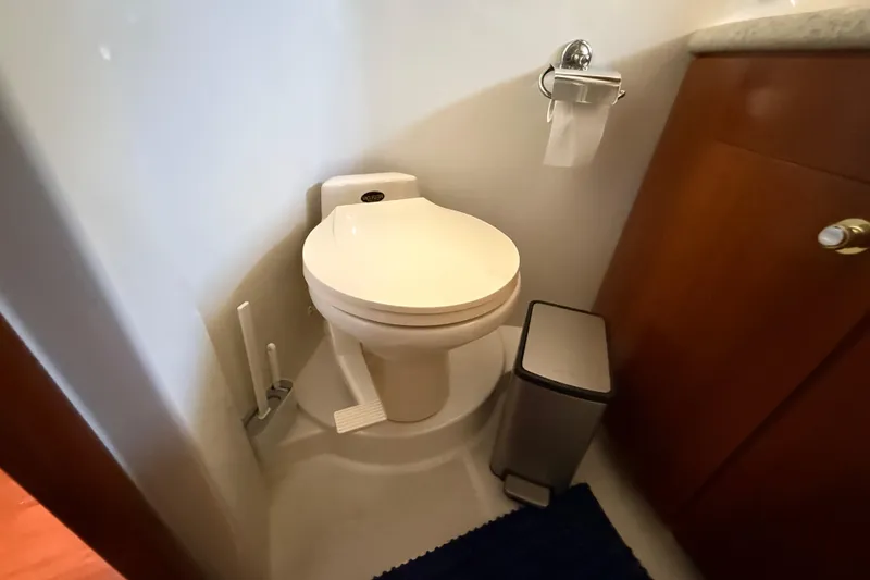 Slide: The Image of Bathroom interior of 1999 Carver 450 Voyager Pilothouse with toilet and waste bin. - 41