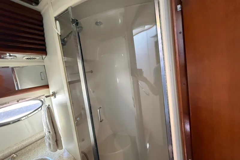 Slide: The Image of Bathroom interior of 1999 Carver 450 Voyager Pilothouse yacht with shower and porthole. - 42