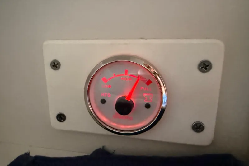 Slide: The Image of Fuel gauge on a 1999 Carver 450 Voyager Pilothouse, indicating low fuel level. - 44