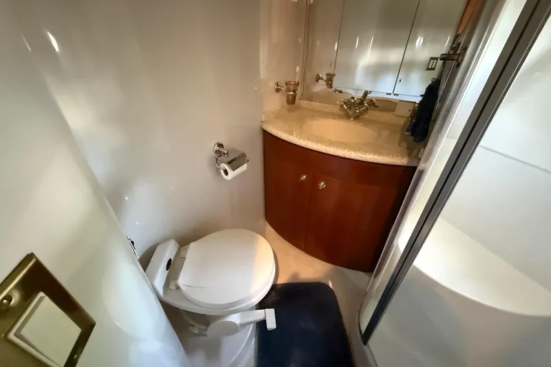 Slide: The Image of Bathroom interior of 1999 Carver 450 Voyager Pilothouse with toilet and vanity. - 47