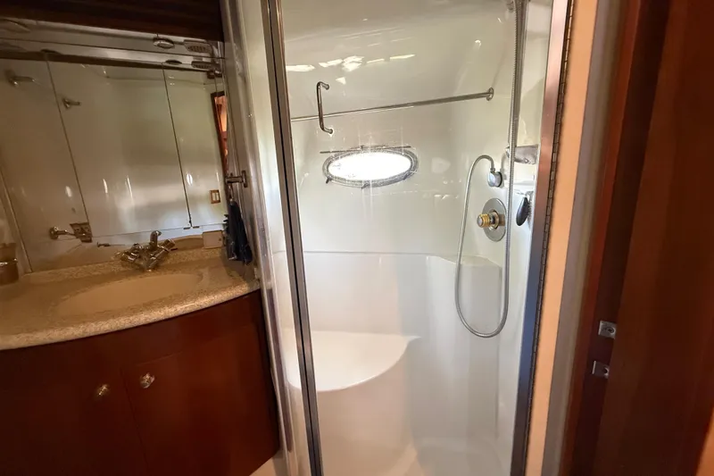 Slide: The Image of Bathroom interior of 1999 Carver 450 Voyager Pilothouse yacht with shower and sink. - 48