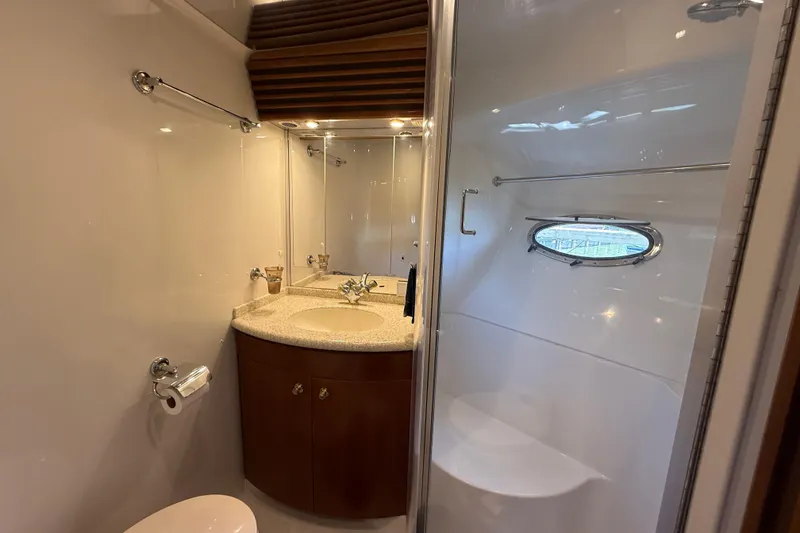 Slide: The Image of Bathroom interior of 1999 Carver 450 Voyager Pilothouse yacht with sink and shower. - 49
