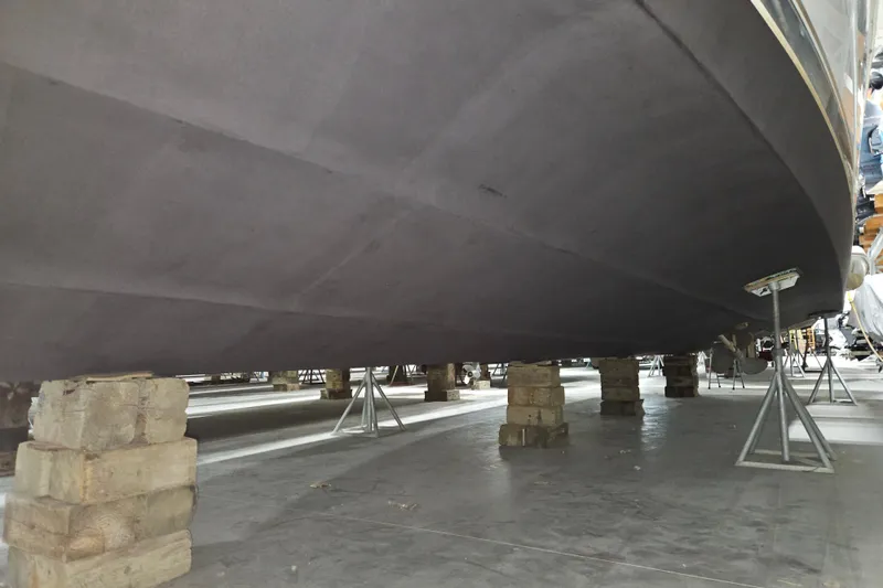 Slide: The Image of Underside view of a 1999 Carver 450 Voyager Pilothouse yacht on supports. - 53