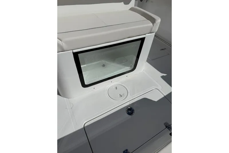 Slide: The Image of 2026 Sea Hunt Ultra 285 Coffin Box with cushioned seating and integrated storage. - 11