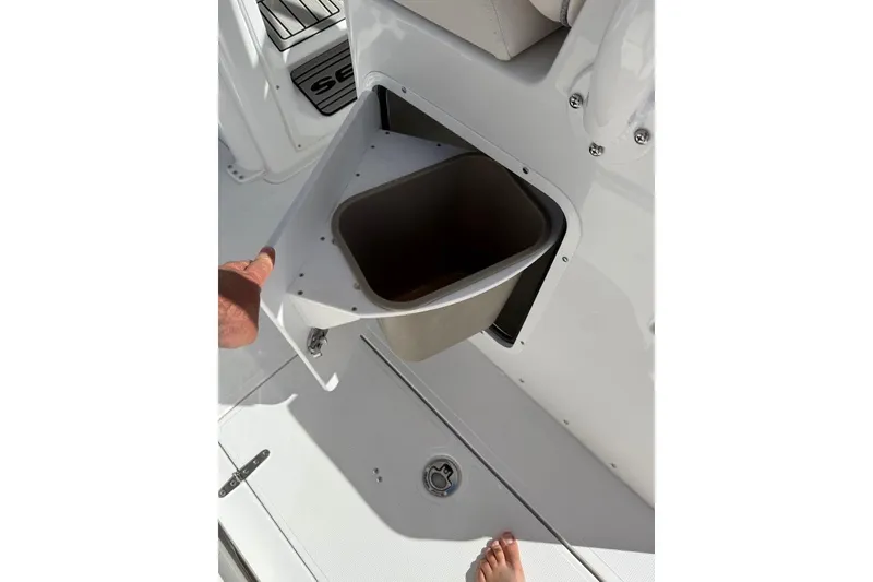 Slide: The Image of 2026 Sea Hunt Ultra 285 Coffin Box interior with seating and storage compartment. - 12