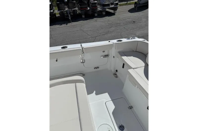 Slide: The Image of 2026 Sea Hunt Ultra 285 Coffin Box with open storage compartment. - 13
