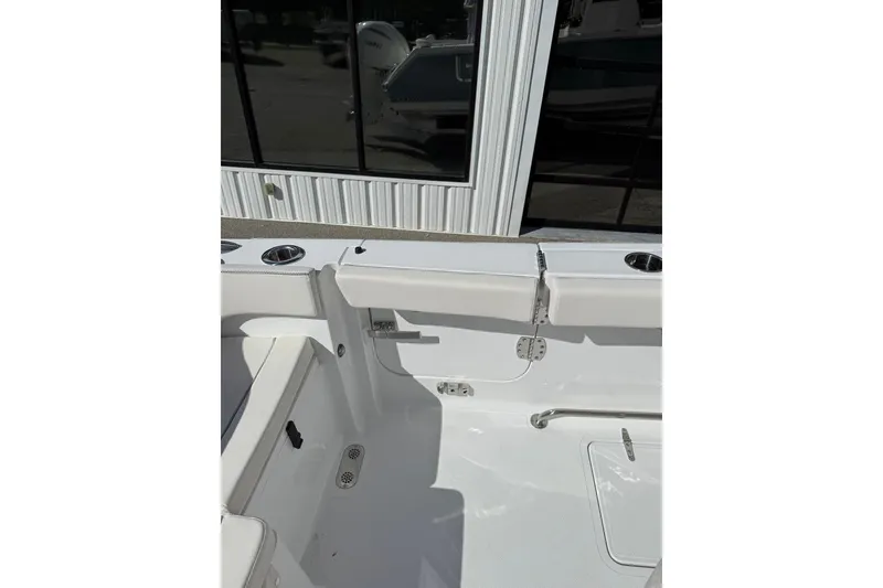 Slide: The Image of 2026 Sea Hunt Ultra 285 Coffin Box boat interior with seating and storage. - 14