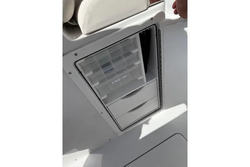 Slide: The Image of 2026 Sea Hunt Ultra 285 Coffin Box boat with dual engines and spacious seating. - 16