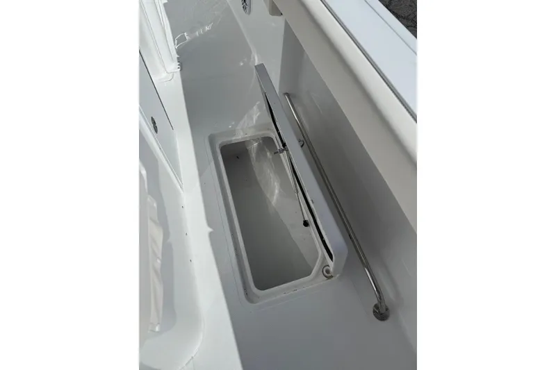 Slide: The Image of Storage compartment on 2026 Sea Hunt Ultra 285 Coffin Box boat, featuring organized drawers. - 17