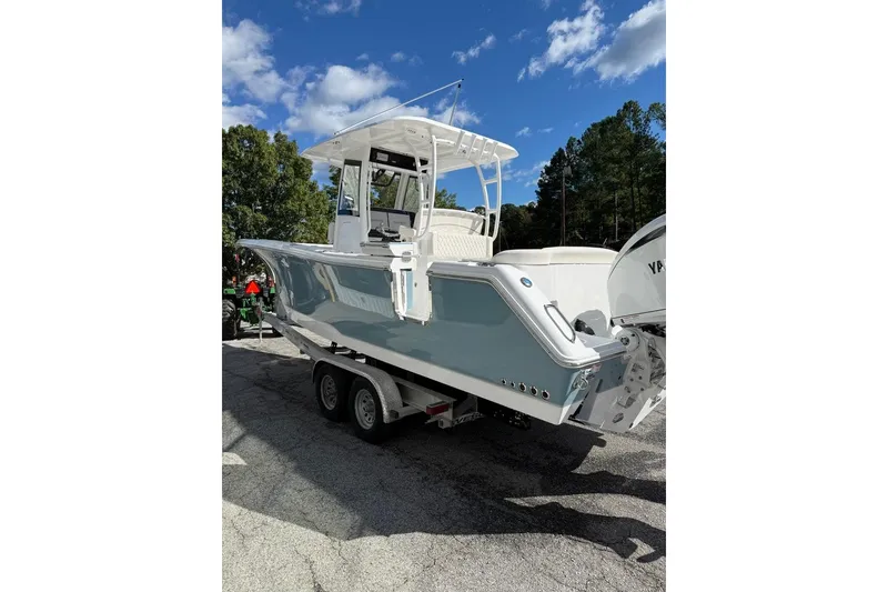Slide: The Image of 2026 Sea Hunt Ultra 285 Coffin Box boat with twin Yamaha engines at Marine 360 dealership. - 2