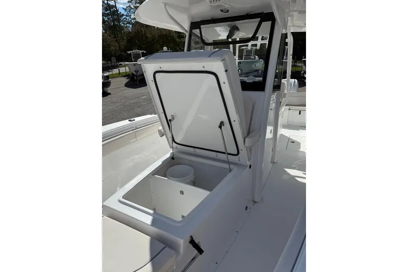 Slide: The Image of 2026 Sea Hunt Ultra 285 Coffin Box boat interior with seating and storage. - 5