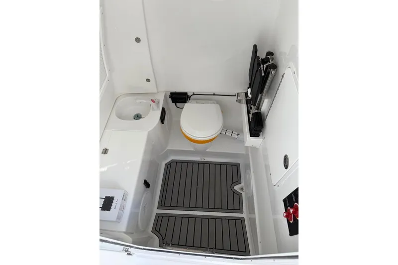 Slide: The Image of 2026 Sea Hunt Ultra 285 Coffin Box with open storage compartment on deck. - 6