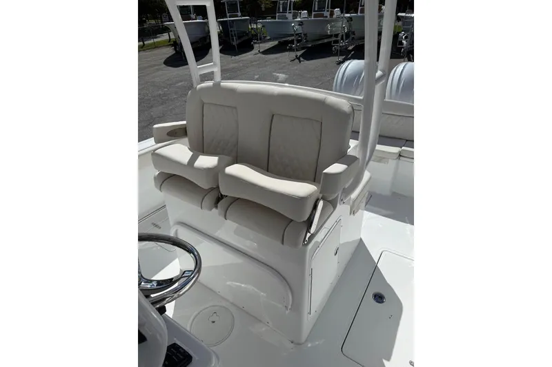 Slide: The Image of Interior of 2026 Sea Hunt Ultra 285 Coffin Box boat, featuring a compact bathroom setup. - 7