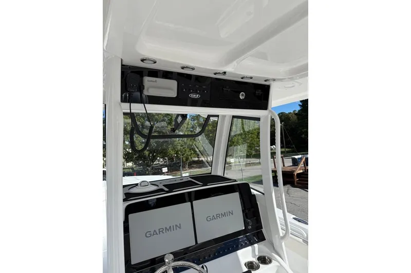 Slide: The Image of Steering console of 2026 Sea Hunt Ultra 285 Coffin Box with Garmin displays. - 9