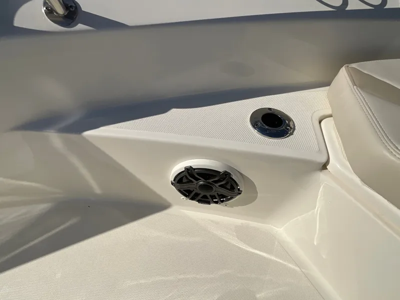 Slide: The Image of Close-up of a speaker and cup holder on a boat. - 19