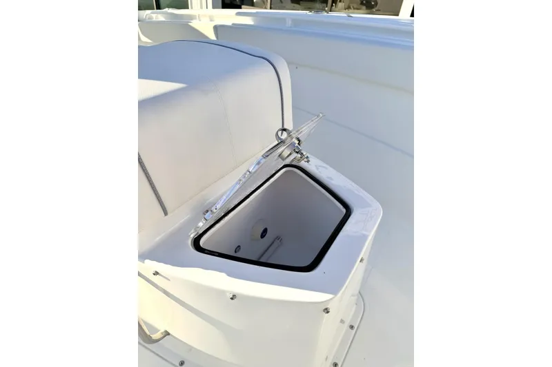 Slide: The Image of 2026 Sea Hunt Ultra 275 Coffin Box boat interior with seating and console. - 10