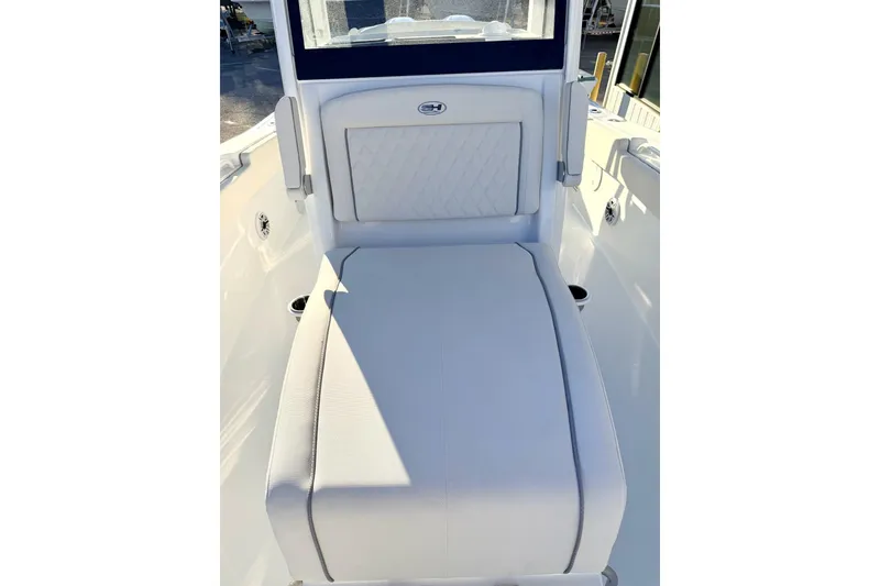 Slide: The Image of 2026 Sea Hunt Ultra 275 Coffin Box open, showcasing interior storage space. - 11