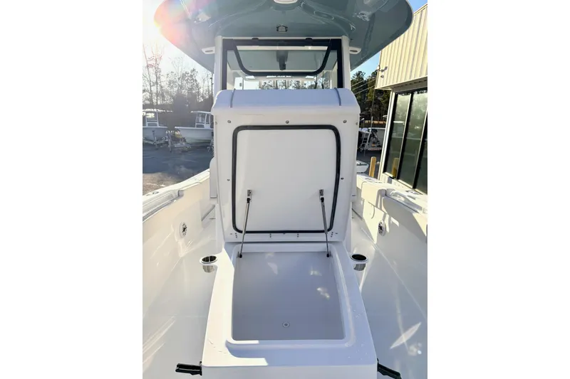Slide: The Image of 2026 Sea Hunt Ultra 275 Coffin Box with cushioned seating and storage. - 12