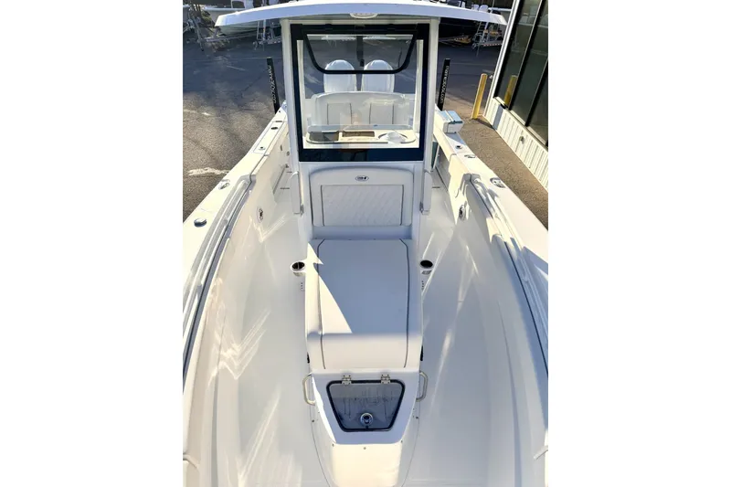 Slide: The Image of 2026 Sea Hunt Ultra 275 Coffin Box open on deck, showcasing storage space. - 13