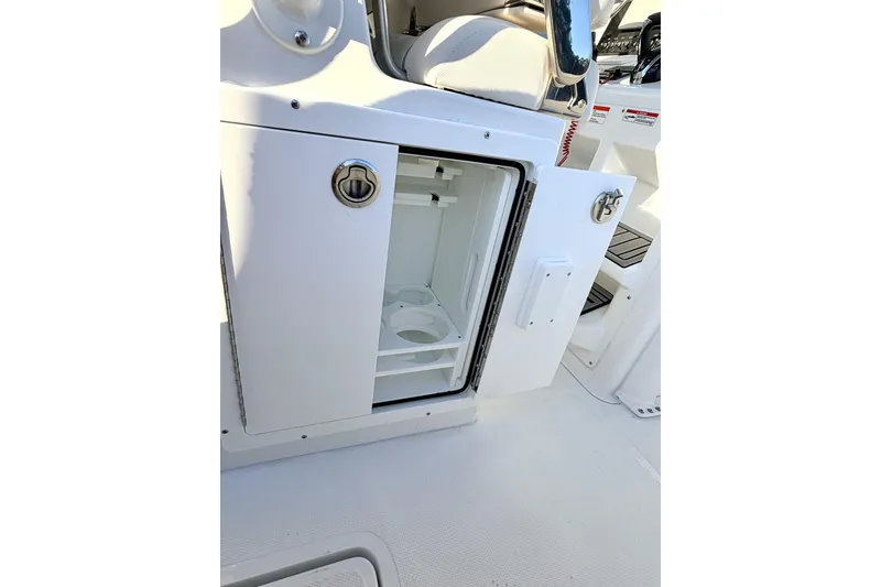 Slide: The Image of Open storage compartment on 2026 Sea Hunt Ultra 275 Coffin Box boat. - 15