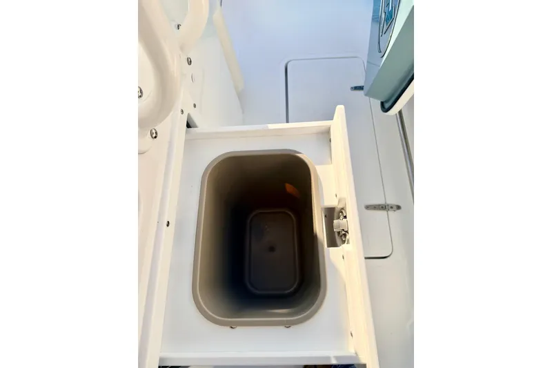 Slide: The Image of 2026 Sea Hunt Ultra 275 Coffin Box storage compartment with secure latch and sleek design. - 17