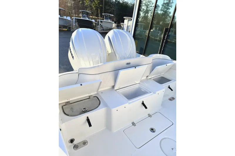 Slide: The Image of 2026 Sea Hunt Ultra 275 Coffin Box boat with dual engines and spacious seating. - 21
