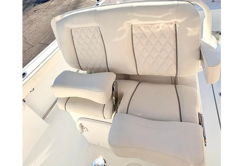 Slide: The Image of 2026 Sea Hunt Ultra 275 Coffin Box boat interior with Yamaha cooler and storage. - 5