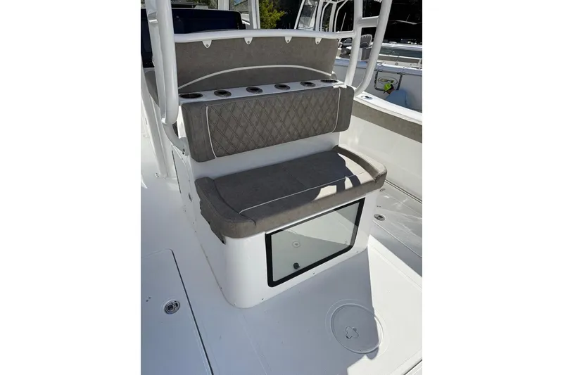 Slide: The Image of 2026 Sea Hunt Ultra 275 Coffin Box boat interior with cushioned seating and storage. - 10