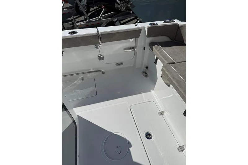 Slide: The Image of Interior view of 2026 Sea Hunt Ultra 275 Coffin Box boat, featuring seating and storage. - 15