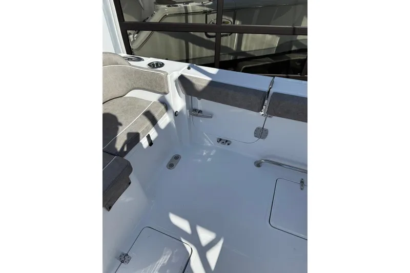 Slide: The Image of Interior view of 2026 Sea Hunt Ultra 275 Coffin Box boat, featuring seating and storage compartments. - 16