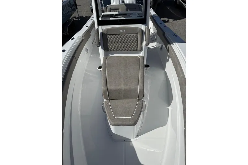 Slide: The Image of 2026 Sea Hunt Ultra 275 Coffin Box boat interior with cushioned seating. - 19