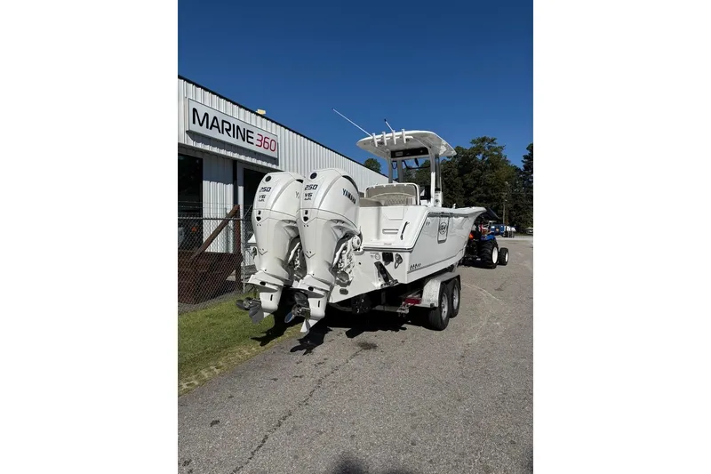Slide: The Image of 2026 Sea Hunt Ultra 275 Coffin Box boat with twin Yamaha 250 engines at Marine 360. - 2