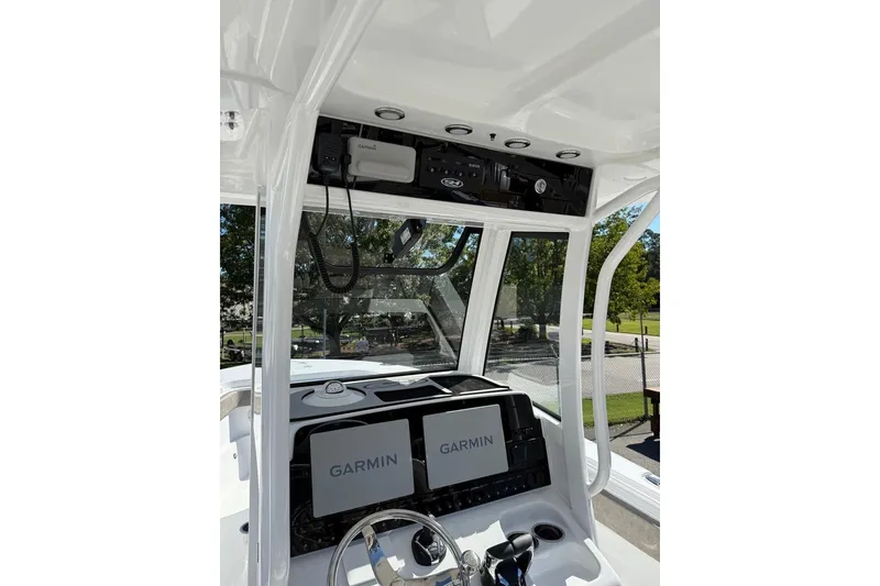 Slide: The Image of 2026 Sea Hunt Ultra 275 Coffin Box boat dashboard with Garmin navigation system. - 24