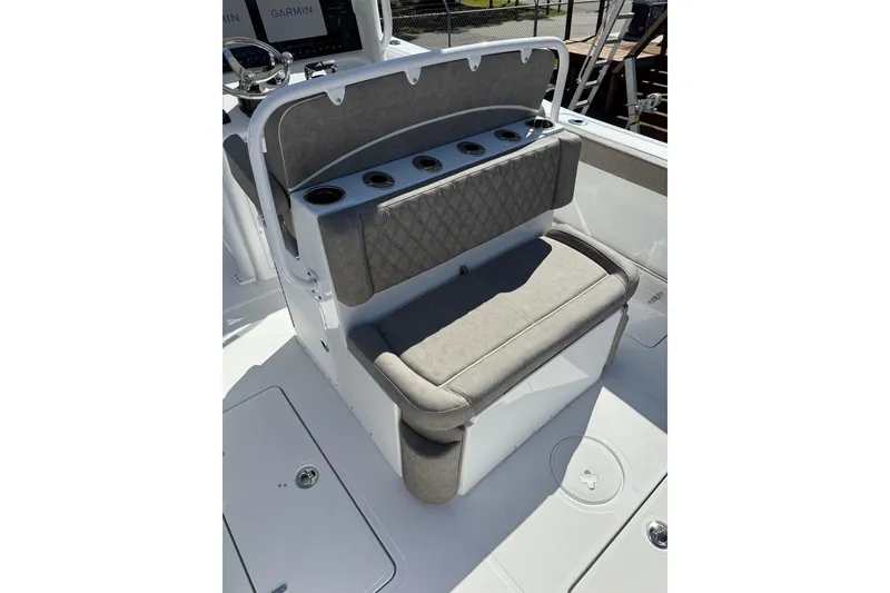Slide: The Image of 2026 Sea Hunt Ultra 275 Coffin Box boat seating with cup holders and cushioned backrest. - 25