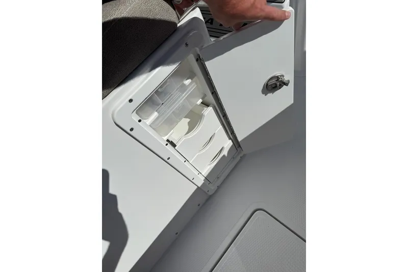 Slide: The Image of Storage compartment on a 2026 Sea Hunt Ultra 275 Coffin Box boat, featuring organized drawers. - 29