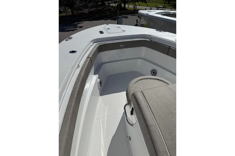 Slide: The Image of 2026 Sea Hunt Ultra 275 Coffin Box boat interior with cushioned seating and storage. - 3
