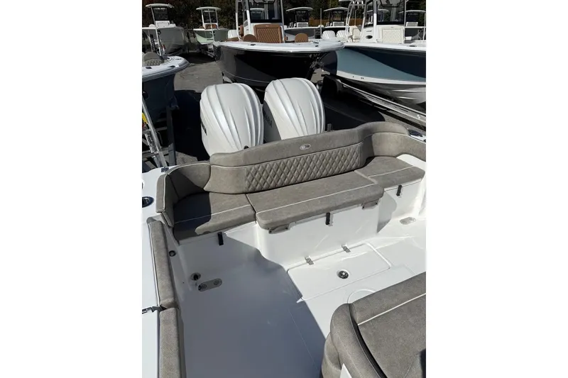 Slide: The Image of 2026 Sea Hunt Ultra 275 Coffin Box boat with cushioned seating and dual engines. - 30