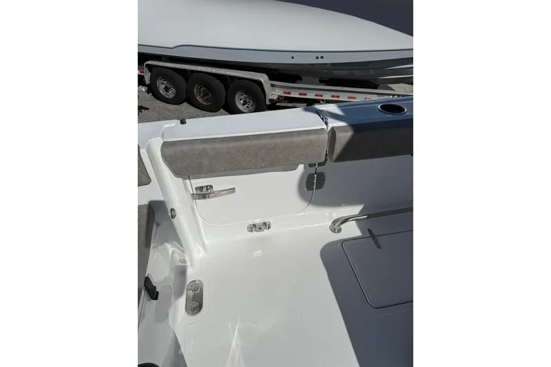 Slide: The Image of 2026 Sea Hunt Ultra 275 Coffin Box boat interior with seating and cup holder. - 32