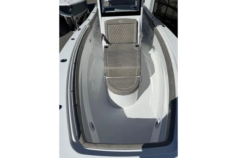 Slide: The Image of 2026 Sea Hunt Ultra 275 Coffin Box boat interior with cushioned seating. - 4