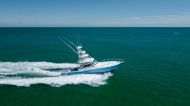 Slide: The Image of 2019 Albemarle 410 Express Fisherman cruising on open water. - 12