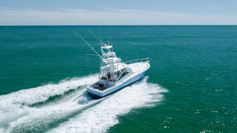 Slide: The Image of 2019 Albemarle 410 Express Fisherman cruising on open water. - 13