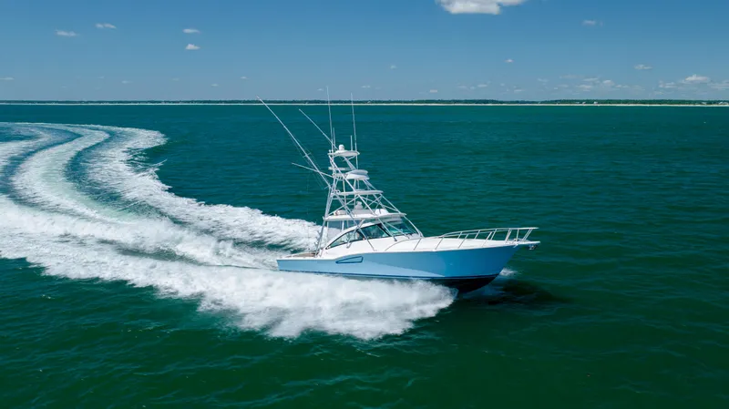Slide: The Image of 2019 Albemarle 410 Express Fisherman cruising on open water. - 14