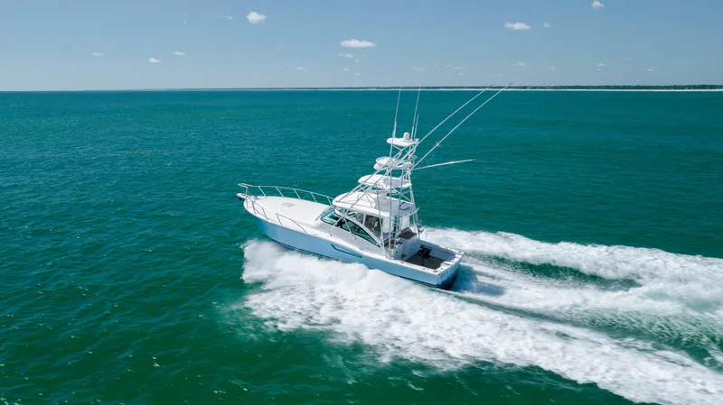 Slide: The Image of 2019 Albemarle 410 Express Fisherman cruising on open water. - 16