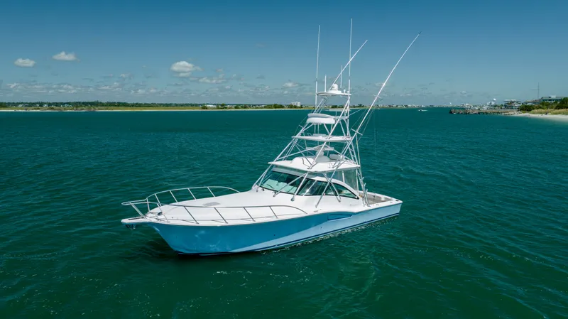 Slide: The Image of 2019 Albemarle 410 Express Fisherman boat on open water. - 2
