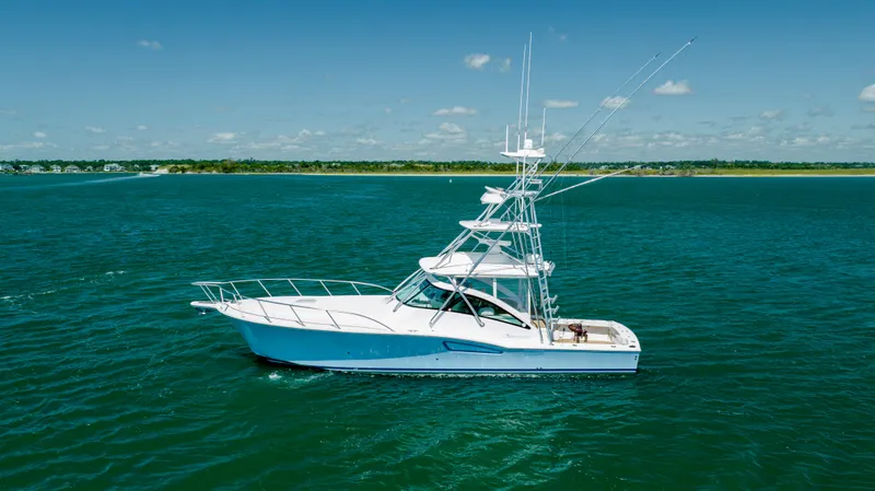 Slide: The Image of 2019 Albemarle 410 Express Fisherman boat on open water. - 6