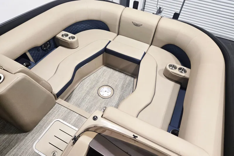 Slide: The Image of Luxurious interior of 2026 Bennington 23 L boat with beige seating and cup holders. - 5