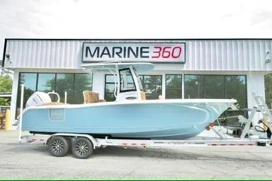Slide: The Image of 2026 Sea Hunt Ultra 255 SE boat on trailer at Marine 360 dealership. - 1